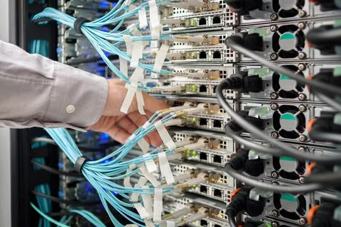 Man data center technician performing server maintenance Stock Photos
