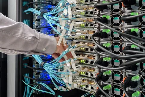 Man data center technician performing server maintenance Stock Photos