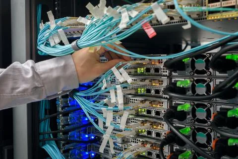 Man data center technician performing server maintenance Stock Photos