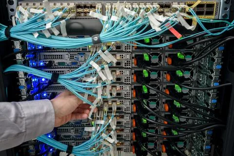 Man data center technician performing server maintenance Stock Photos