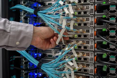 Man data center technician performing server maintenance Stock Photos