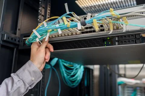 Man data center technician performing server maintenance Stock Photos