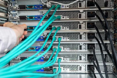Man data center technician performing server maintenance Stock Photos