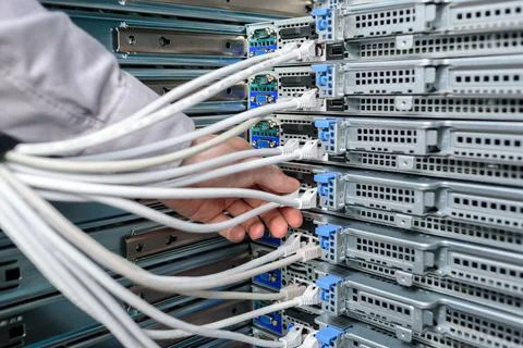 Man data center technician performing server maintenance Stock Photos