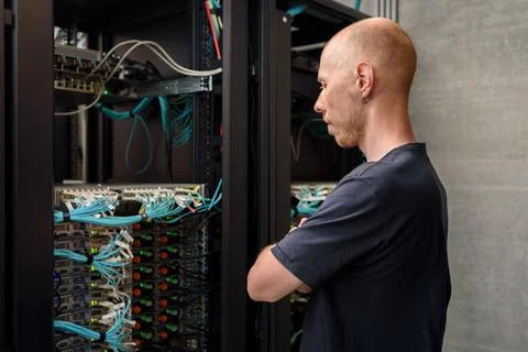 Man data center technician performing server maintenance Stock Photos