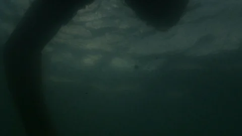 Man dead floating in ocean Stock Footage 94526604