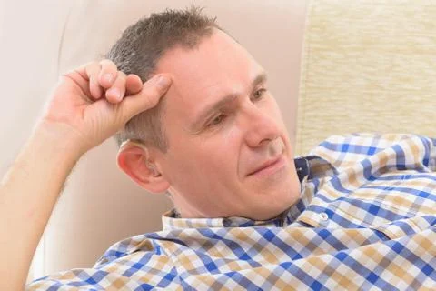 Man with deaf aid Stock Photos