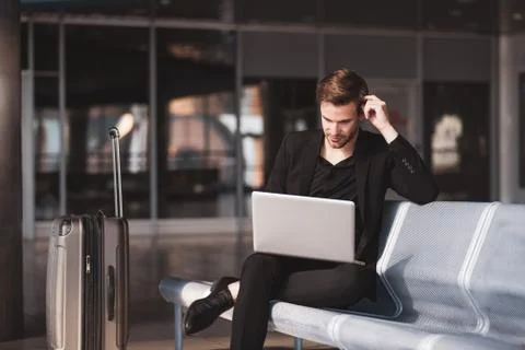 Man dealing with his task while waiting for the boarding Foto stock