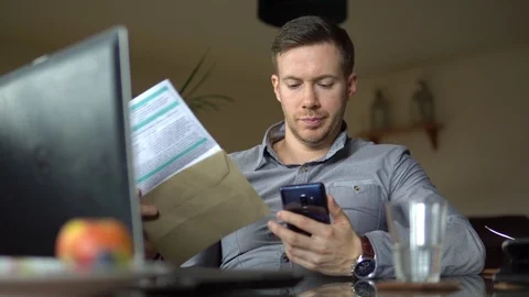 A Man With Debt Problem Contacts Credit Company On Phone For Help And Assurance Stock Footage 107329010