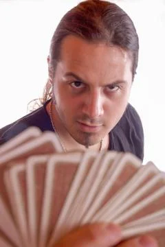 Man with a deck of cards in his hand Stock Photos