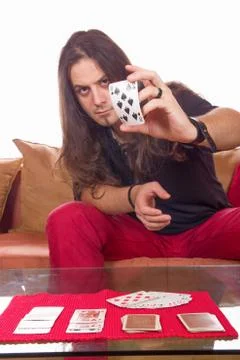 Man with a deck of cards on the table Stock Photos