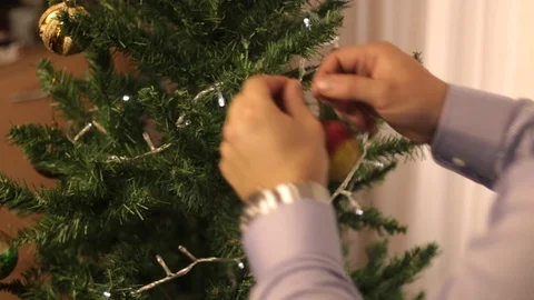 Man decorat Christmas tree Stock Footage 80990592