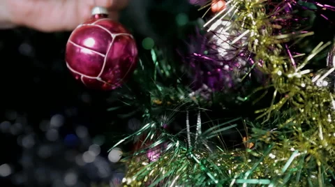 Man decorating the christmas tree Stock Footage 57533574
