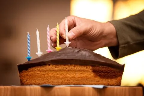 Man is decorating a marble cake 写真素材