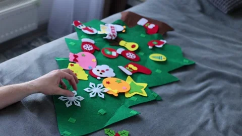 Man decorating toy Christmas tree. 4K Stock Footage 322028771