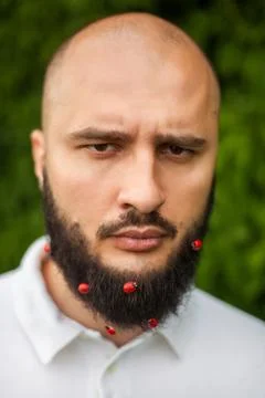 Man with decoration in beard Foto stock