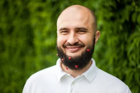 Man with decoration in beard Stock Photos