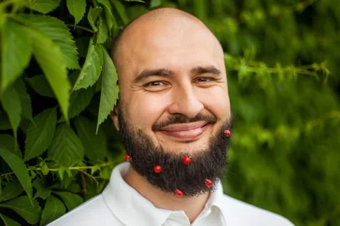 Man with decoration in beard Stock Photos