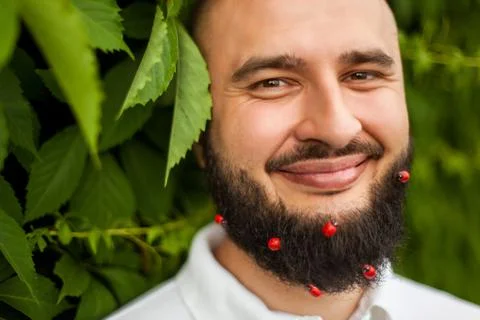 Man with decoration in beard Stock Photos