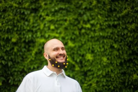Man with decoration in beard Stock Photos
