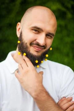 Man with decoration in beard Stock Photos