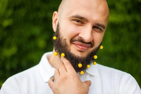 Man with decoration in beard Stock Photos