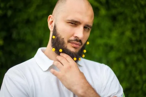 Man with decoration in beard Stock Photos