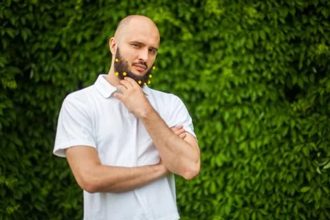 Man with decoration in beard Stock Photos