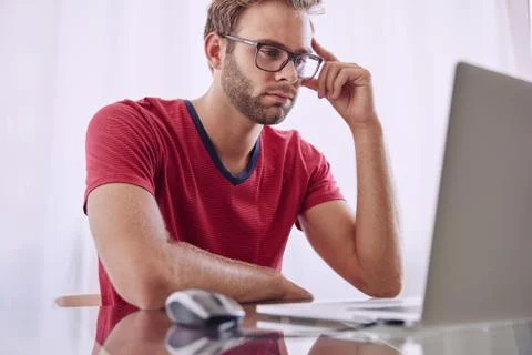 Man deep in concentration infront of computer Stock Photos