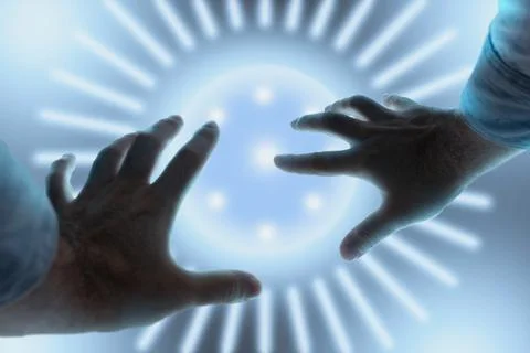 Man defends himself with his hands from strange glowing orb above him Stock Photos
