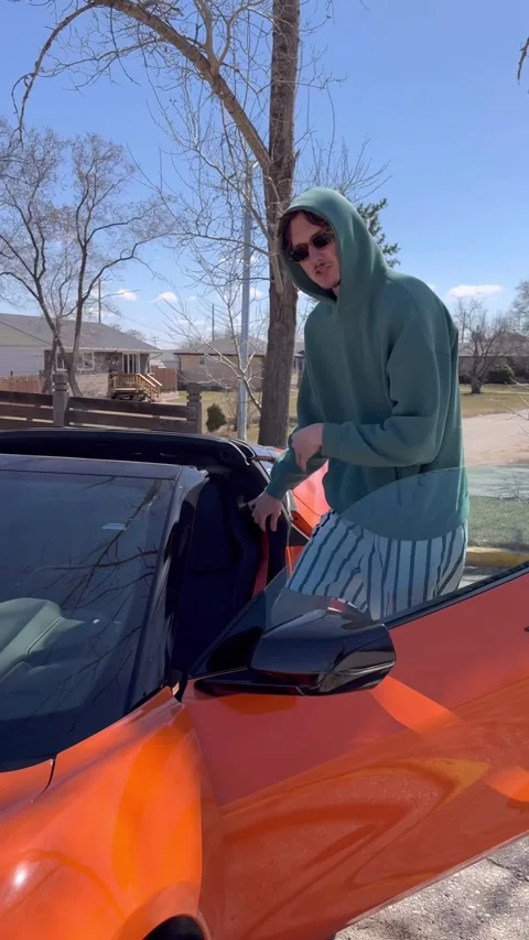 Man Is Definitely Not Too Tall for His Corvette, Winnipeg, Manitoba, Canada - 25 Stock Footage 309821922