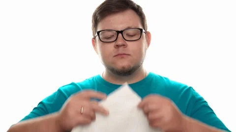 Man delicately eats a pear but gets angry at the end Stock Footage 112772528