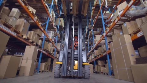 Man deliver parcels in warehouse Stockbeeldmateriaal 117296070