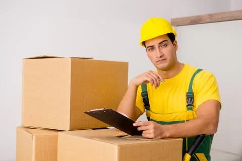 Man delivering boxes during house move Stock Photos