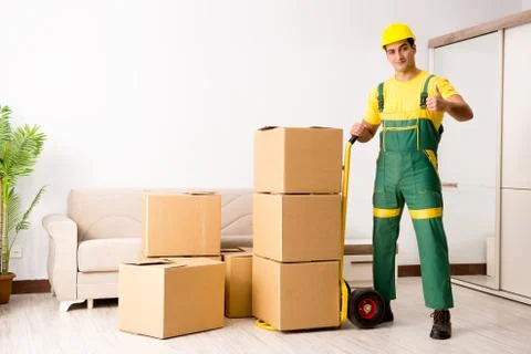 Man delivering boxes during house move Stock Photos