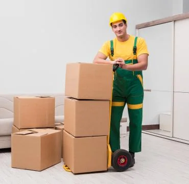 Man delivering boxes during house move Stock Photos