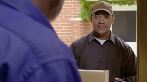 Man delivering package to customer at home Stock-Footage 79507124