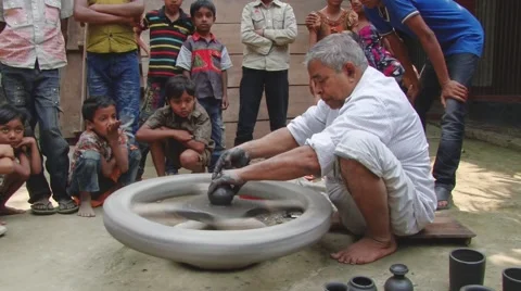 Man demonstrates to children process of clay pottery production. Stock Footage 48170022