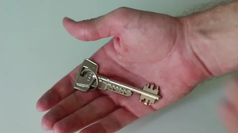 Man demonstrates keys of a new flat Vídeo Stock 65371438