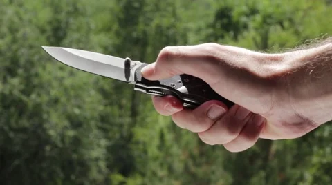 Man demonstrates penknife Stock Footage 66755597