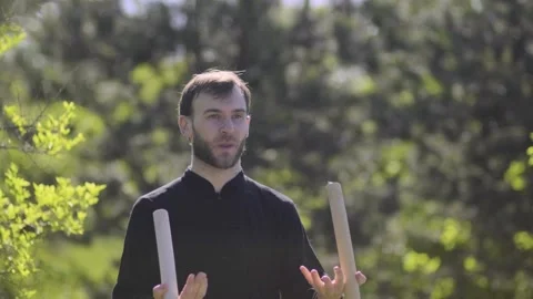 A man demonstrates the skill of kung fu with the two sticks Stock Footage 132463768