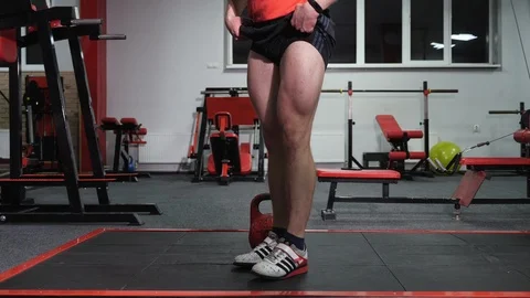 A man demonstrates the work of the muscles of the legs. Stock Footage 119175099