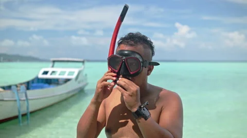 Man demonstrating the proper use of snorkeling gear Stock Footage 341959504