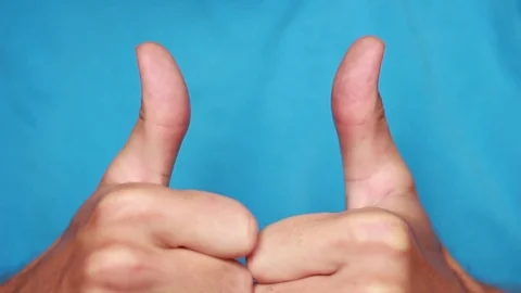 Man demonstrating thumbs closeup 動画素材 75026199