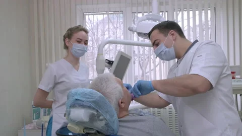 Man dentist with nurse making casts of patient teeth in dental clinic Stock-Footage 219501100