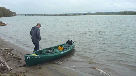 Man Departing on Canoe Stock Footage 2586659