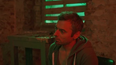 A man in a depression under the influence of various drugs. Stock Footage 83089749