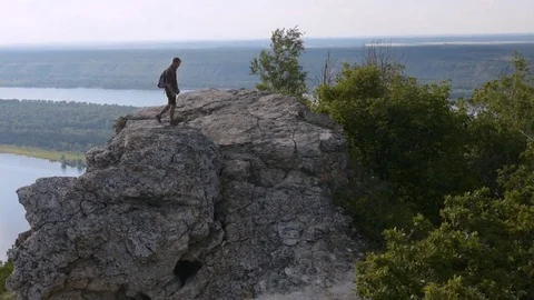 Man descends from the mountain Stock Footage 72587675