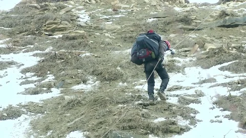 Man descends from the mountain on a rope Stock Footage 70620730