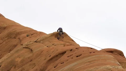 Man Descends From Rock Climbing Stock-Footage 78991948